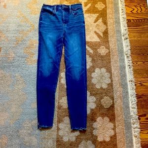 These American Eagle jeans are super high rise frayed at the bottom.